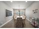 Bright dining room featuring stylish decor, a large table with seating, and modern lighting at 2136 Lula Rd, Minneola, FL 34715