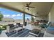 Spacious covered patio with ceiling fans, comfortable seating, and outdoor dining area perfect for entertaining at 2136 Lula Rd, Minneola, FL 34715