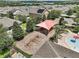 Aerial view of the community playground, featuring swings, a shade structure, and seating near the pool at 2136 Lula Rd, Minneola, FL 34715
