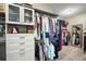 Organized walk-in closet features custom shelving, drawers, and ample hanging space for clothes and accessories at 2136 Lula Rd, Minneola, FL 34715