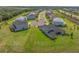 Aerial view showcases a spacious backyard, perfect for outdoor activities, in a desirable neighborhood at 2161 Cedar Springs Way, Minneola, FL 34715