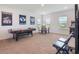 Finished basement featuring ping pong, dining table, and arcade games at 2161 Cedar Springs Way, Minneola, FL 34715