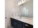 Bathroom featuring vanity with ample storage space and bright lighting at 2161 Cedar Springs Way, Minneola, FL 34715