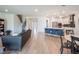 Open floorplan with kitchen island, dining area, living room, and staircase at 2161 Cedar Springs Way, Minneola, FL 34715