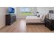 A cozy main bedroom with bright natural light and neutral decor at 2161 Cedar Springs Way, Minneola, FL 34715