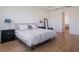Relaxing main bedroom featuring light wood floors and ensuite access at 2161 Cedar Springs Way, Minneola, FL 34715