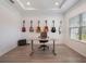Well-lit home office boasting guitars hung on the wall, providing a creative and inspiring workspace at 2161 Cedar Springs Way, Minneola, FL 34715