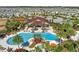 Resort style pool with lounge chairs, hot tub, lush landscaping, and a clubhouse in this Primary planned community at 2161 Cedar Springs Way, Minneola, FL 34715