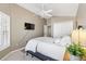 Tranquil bedroom with vaulted ceilings, ceiling fan, shuttered windows, and a spacious closet at 2465 Violet Ct, The Villages, FL 32162