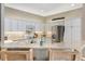 Well-equipped kitchen with stainless steel appliances, granite countertops, and breakfast bar at 2465 Violet Ct, The Villages, FL 32162