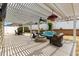 Beautifully designed patio with pergola, fire pit, and comfortable outdoor seating, perfect for relaxation at 2465 Violet Ct, The Villages, FL 32162