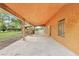 Covered patio with a brick wall, concrete floor, and an open view to backyard at 25888 Se 157Th Ln, Umatilla, FL 32784
