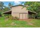Charming barn featuring a rustic design with weathered wood and a functional, sturdy structure at 25888 Se 157Th Ln, Umatilla, FL 32784