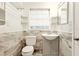 Bathroom featuring neutral tile work, a window for natural light, and vanity sink at 25888 Se 157Th Ln, Umatilla, FL 32784