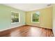 Bedroom featuring a window and natural light, and hardwood flooring at 25888 Se 157Th Ln, Umatilla, FL 32784