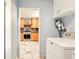 Laundry area featuring a washer, dryer and view into a kitchen at 25888 Se 157Th Ln, Umatilla, FL 32784