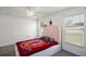 Bright bedroom with carpet, fan, and window for natural light at 314 Stone Castle Loop, Lady Lake, FL 32159
