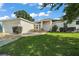 Charming single-story home with a well-maintained lawn and double door entrance, offering great curb appeal at 314 Stone Castle Loop, Lady Lake, FL 32159