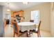 Bright kitchen and breakfast nook with stainless steel appliances, tile flooring, and ample natural light at 3213 White Blossom Ln, Clermont, FL 34711