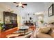 Comfortable living room with rich wood floors and elegant furnishings at 3213 White Blossom Ln, Clermont, FL 34711