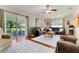 Open living room with a sliding glass door to the outdoor living space at 3213 White Blossom Ln, Clermont, FL 34711