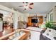 Cozy living room with an entertainment center and comfortable seating at 3213 White Blossom Ln, Clermont, FL 34711