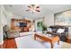 Bright living room with large windows and a media center at 3213 White Blossom Ln, Clermont, FL 34711