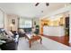 Bright living room with a view into the kitchen at 3213 White Blossom Ln, Clermont, FL 34711
