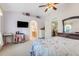 Comfortable main bedroom with archway to the ensuite bath and living area at 3213 White Blossom Ln, Clermont, FL 34711