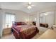 Bedroom with mirrored closet and decorative bedding at 32339 Oak Park Dr, Leesburg, FL 34748