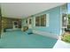 Wide angle of the covered and screened-in carport, featuring easy access to the home at 32339 Oak Park Dr, Leesburg, FL 34748