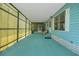 Spacious carport featuring a screened-in area and access to the home's entrance at 32339 Oak Park Dr, Leesburg, FL 34748