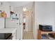 Hallway with refrigerator, microwave, and access to other rooms at 32339 Oak Park Dr, Leesburg, FL 34748