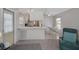 Eat-in kitchen with white cabinetry and a cozy dining area at 32339 Oak Park Dr, Leesburg, FL 34748