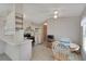 Open kitchen featuring white appliances and adjacent dining space at 32339 Oak Park Dr, Leesburg, FL 34748