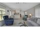Inviting living room showcasing an open floor plan with kitchen view at 32339 Oak Park Dr, Leesburg, FL 34748