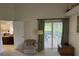 Bedroom featuring neutral carpet, vaulted ceiling, and sliding glass doors leading to outdoor patio at 3605 Kingswood Ct, Clermont, FL 34711