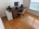 Bedroom with hardwood floors, a desk, and lots of sunlight at 3605 Kingswood Ct, Clermont, FL 34711