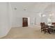 Expansive dining area features neutral carpet, a stylish chandelier, and an open layout at 3605 Kingswood Ct, Clermont, FL 34711