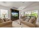 Bright living room boasts neutral decor, vaulted ceilings, and large windows at 3605 Kingswood Ct, Clermont, FL 34711