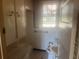 Functional bathroom with white tile and vintage fixtures at 3999 Walker Lake Rd, Bartow, FL 33830