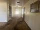 Aged interior featuring neutral walls, aged carpet, and natural light at 3999 Walker Lake Rd, Bartow, FL 33830