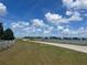 Scenic view of a winding road alongside a lake, creating a peaceful landscape at 3999 Walker Lake Rd, Bartow, FL 33830