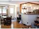 Open concept dining area with hardwood floors, seamlessly connecting to the bright and airy kitchen at 40 N Triplet Lake Dr, Casselberry, FL 32707
