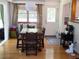 Cozy dining area with hardwood floors, natural light, and a view into the kitchen area at 40 N Triplet Lake Dr, Casselberry, FL 32707