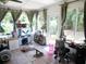 Light-filled sunroom with tile flooring, large windows, and natural light at 40 N Triplet Lake Dr, Casselberry, FL 32707