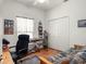 Bright bedroom featuring a ceiling fan, closet, natural light, and a versatile desk and work area at 4814 Saint Andrews Arc, Leesburg, FL 34748