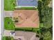 Aerial view of the roof, landscaping, and neighborhood at 487 Thistledown Way, The Villages, FL 32162