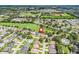 Stunning aerial shot of the property, showcasing its proximity to community amenities and green spaces at 487 Thistledown Way, The Villages, FL 32162