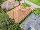 Aerial view of a home's roof, showcasing its design and neighborhood setting at 487 Thistledown Way, The Villages, FL 32162